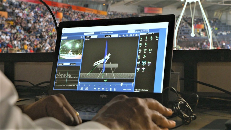 AI computer vision technology for gymnastics judging showing future hybrid system combining automated technical scoring with human artistic evaluation reducing bias - InfoProds 2026.