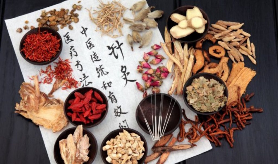 Traditional Chinese medicine herbs and roots arranged with ancient text showing holistic approach to nervous system health through time-tested botanical formulas - adaptogenic and nervine herbs from Asian healing traditions - InfoProds 2026 integrative medicine guide