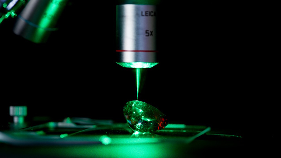 Sophisticated spectroscopy and microscopy equipment in certified gemological laboratory used for accurate gemstone treatment detection and authentication - InfoProds laboratory testing technology 2026