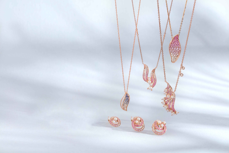 Layered jewelry styling with multiple necklaces stacked rings and coordinated accessories