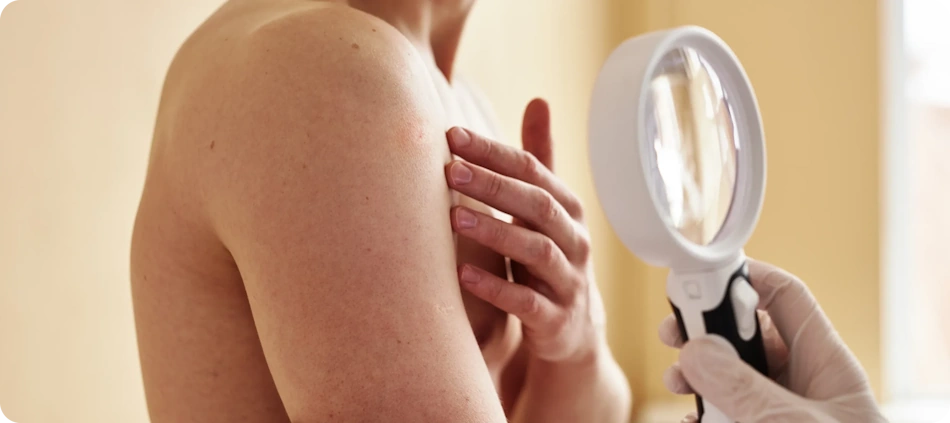 Professional board-certified dermatologist carefully examining patient's rough dry skin condition on hands during medical consultation to diagnose underlying causes and develop personalized prescription treatment plan for severe xerosis - InfoProds 2026 healthcare beauty