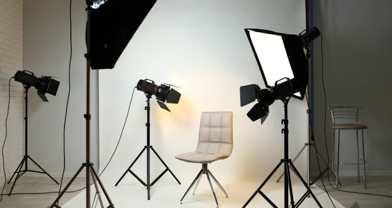 Multi-point professional lighting system with softboxes, fill lights, and reflectors demonstrating the expensive equipment beauty influencers use to eliminate skin texture and create flawless appearances impossible in normal lighting - InfoProds 2026