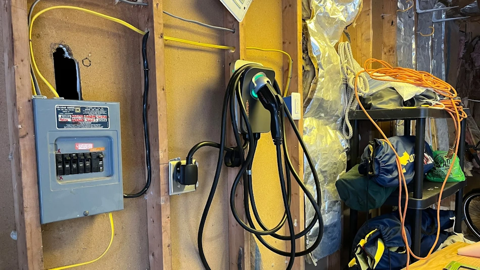 Licensed electrician installing dedicated 240-volt circuit for Level 2 EV charger in residential garage showing proper conduit, wiring, and code-compliant installation techniques - InfoProds 2026
