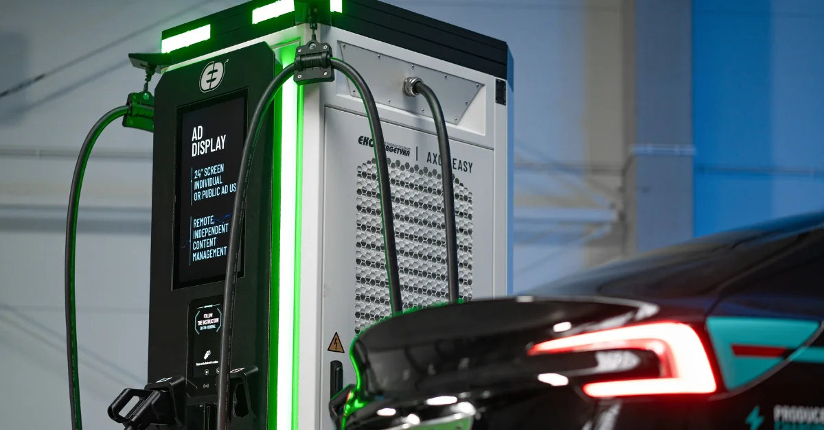 DC fast charging station displaying per-kilowatt-hour pricing and time-based fees showing public charging network costs for electric vehicles - InfoProds 2026