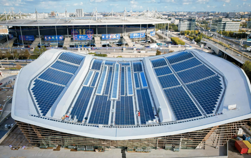 Environmentally sustainable Olympic swimming facility featuring solar panel heating systems water recycling technology and energy-efficient design elements representing future of competitive aquatic venue construction - InfoProds 2026