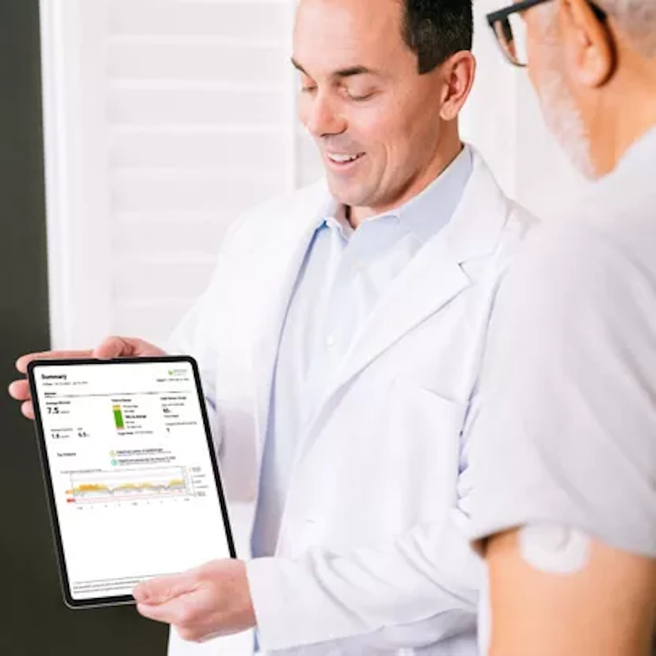 Diabetes patient and healthcare provider reviewing detailed continuous glucose monitoring data on tablet showing blood sugar trends, time in range metrics, and personalized treatment recommendations for optimal diabetes management decisions 2026 - InfoProds