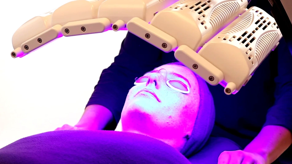 Radiant woman with healthy glowing skin after completing LED light therapy face mask treatment protocol showing improved texture collagen and anti-aging benefits - InfoProds 2026