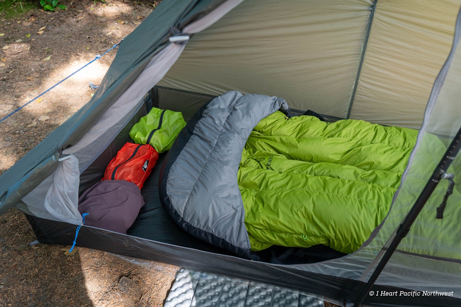 Interior view of double-wall ultralight tent showing dry sleeping area and gear storage during heavy rain testing with condensation measurement equipment and moisture sensors positioned throughout shelter space - InfoProds Camping Gear Testing 2026