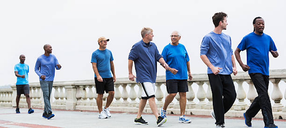 Diverse fitness group enjoying brisk walking workout together in natural outdoor setting demonstrating sustainable low-impact exercise for long-term weight loss maintenance and social accountability - InfoProds 2026