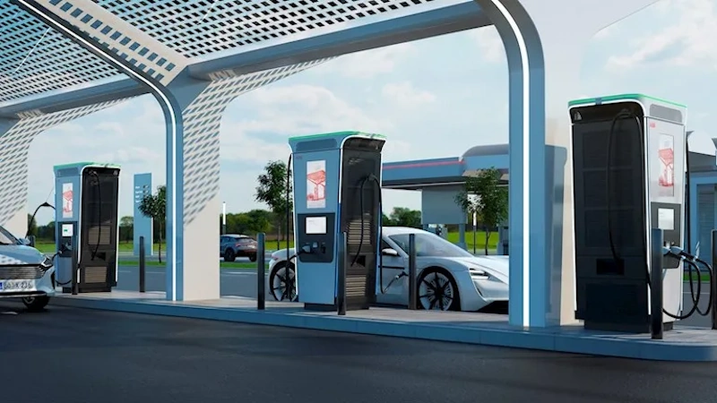 Modern electric vehicle charging station showing fast DC charging equipment with digital displays and multiple charging ports for Tesla Supercharger and third-party network infrastructure comparison - EV charging speed testing InfoProds 2026