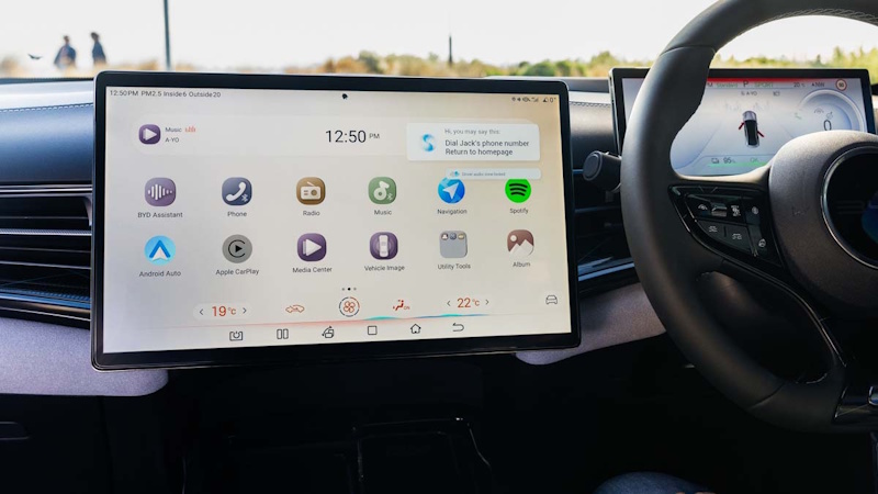 Modern car dashboard displaying wireless Apple CarPlay and Google Android Auto interface comparison showing connectivity features navigation controls and smartphone integration systems in 2026 vehicles - InfoProds 2026