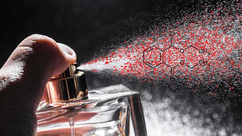 Phthalates Hidden in Fragrances Perfume bottles and fragranced beauty products with molecular structure overlay showing hidden phthalates concealed behind generic fragrance ingredient listings without disclosure requirements - InfoProds 2026